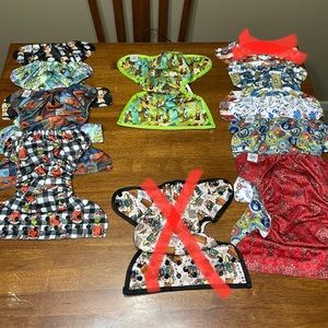Texas Tushies Pocket Diapers and (1) cover. Lot of 9